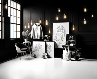 A curated selection of Maison Memoire's personalized items, including a hoodie and tote bag with line art, elegantly arranged in a monochromatic setting.