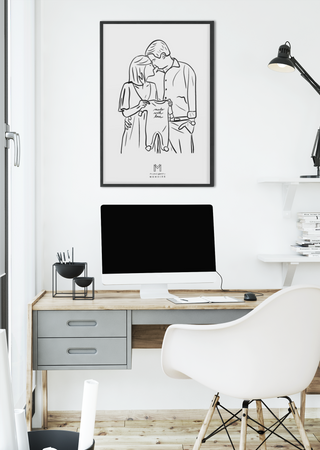 A Maison Memoire art print framed above a sleek, modern desk infuses the space with a story of tenderness.